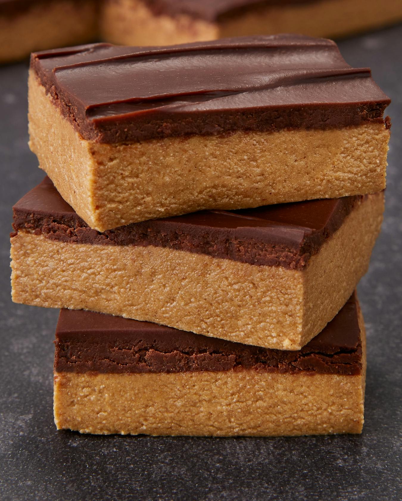 A stack of peanut butter brownies, that were made with Dymatize powder.
