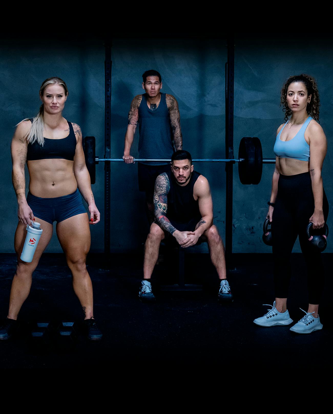 Four athletes in a gym.